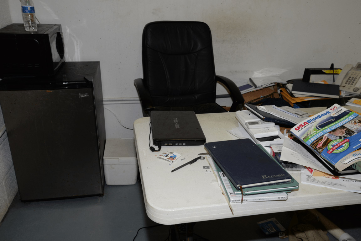 cluttered desk notebooks office